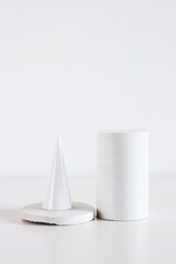 stone figures from natural material on white background, copyspace, Concept minimal decoration in interior at home, vertical.