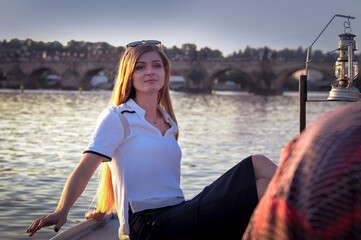 Fototapeta premium portrait of a girl in a golden hour on Vltava River