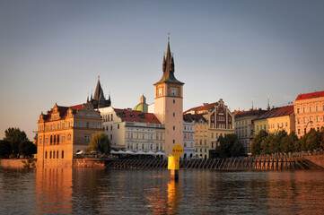 Fototapeta na wymiar prague street and muzeum Bedricha Smetany view from Vltava river at sunset golden hour