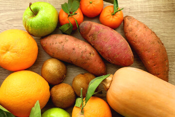 Various healthy fruit and vegetable on wooden background. Top view.