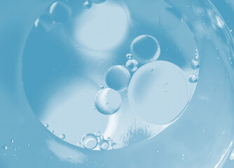The surface of the water. An image of a drop of oil on water. Background for the design.