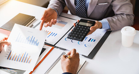 Business people meeting to analyze and discuss and brainstorm data, charts, reports showing investment results and financial profits in the office. financial advisor Teamwork and Accounting Concepts