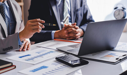 Business team working on new startup projects. Discuss the analysis of charts and graphs showing investment performance reports. and profit accounting and finance business ideas