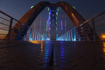 The bridge is a hand reaching from the past to the future.