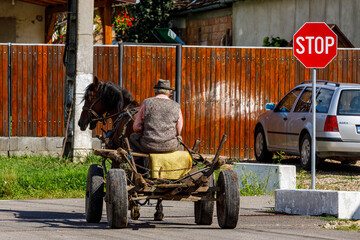 Horse carriage and farmer in Biertan Romania