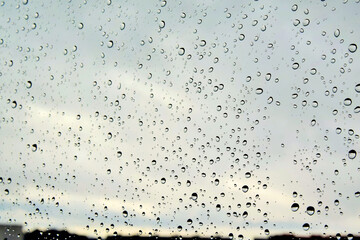 Naklejka na ściany i meble on photo rain drops on a window glass