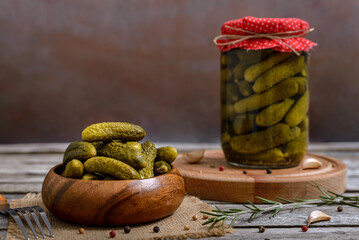 Pickles in a wooden bowl and jar