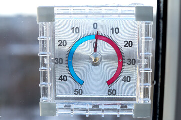 Square outdoor thermometer shows 1 degree above zero 