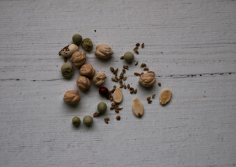 Garden seeds on a vintage whitewashed wooden surface