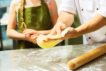 Male hands motion round pizza.