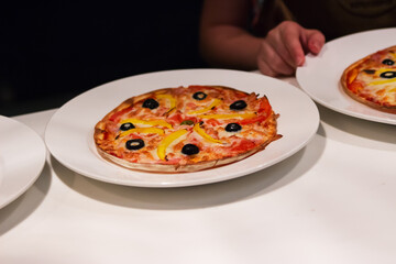 Round pizza white table portion.
