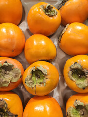 Fresh orange Persimon fruit .Kaki fruits on market
