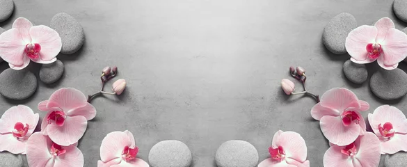 Keuken achterwand Spa Platte lay compositie met spa stenen, orchidee roze bloem op grijze achtergrond.  © Belight