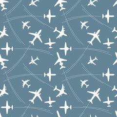 seamless pattern with white silhouettes of passenger airplanes and flight paths