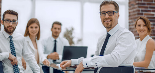 Manager and business team sitting at their Desk