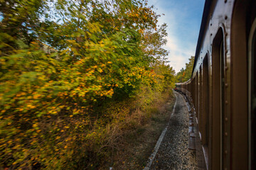 Fototapeta premium Train trip to Abruzzo, the Trans-Siberian of Italy, Journey through mountains and woods in autumn, a beautiful landscape 