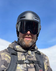 Portrait of a male snowboarder wearing ski googles
