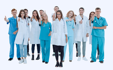 Obraz premium in full growth. smiling team of doctors showing thumbs up
