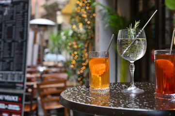 Historical street of Rome with glasses of drink. - 489409229