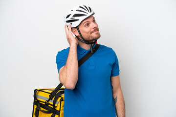Young brazilian man with thermal backpack isolated on white background thinking an idea