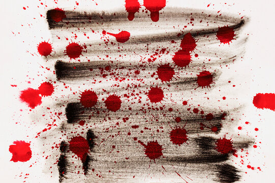 Abstract background with red blood-like splashes on dark background