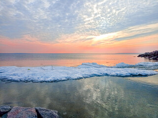 Sunset sky over sea in the evening with colorful clouds