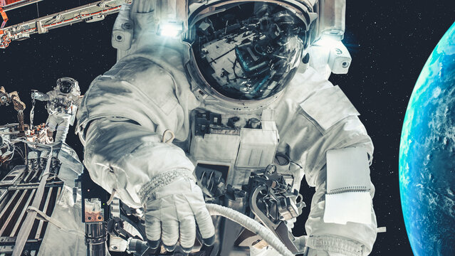 Astronaut spaceman do spacewalk while working for spaceflight mission at space station . Astronaut wear full spacesuit for operation . Elements of this image furnished by NASA space astronaut photos .