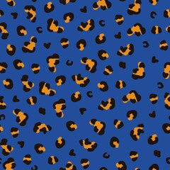 Seamless abstract pattern. black and orange leopard spots on a blue background. vector texture. trendy print for textiles, wallpaper.