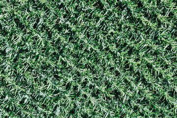 Artificial grass horizontal textured background, imitation of natural grass.