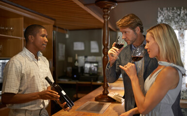 this was a good year. Shot of a couple enjoying a wine tasting.