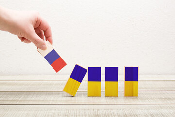 Fototapeta na wymiar dominoes with flags of russia and ukraine, concept of war between countries, russia attack on ukraine