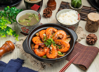 Fragrant Pot Prawns with rice and soup isolated on mate top view of chinese food table