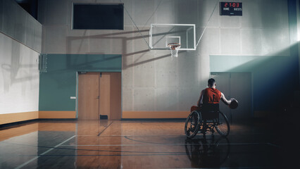 Wheelchair Basketball Player Dribbling Ball Like a Professional, Ready to Shoot. Depressive Mood, Concept of Sadness, Gray Colors Person with Disability Trying Team Sport. Back View Shot