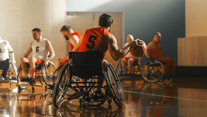 Fototapeta Wheelchair Basketball Game Court: Active Professional Player Dribbling Ball, Prepairing to Shoot and Score a Goal. Determination, Inspiration, and Skill of a People with Disability. obraz