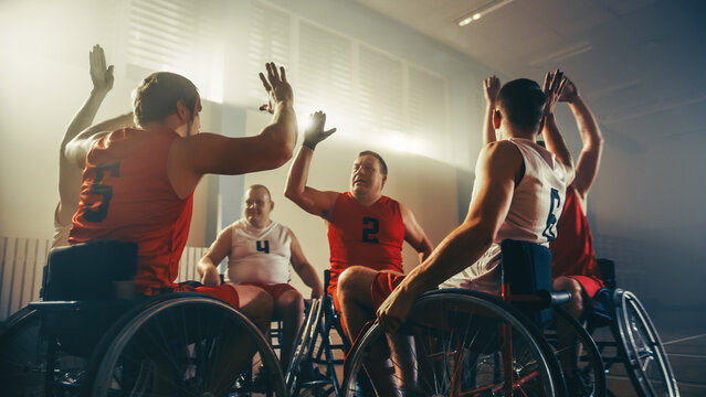 Wheelchair Basketball Game Court Winning Team Celebrate Victory, Cheer And High Five. Players Compete, Shoot, Score Goal Points. Determination, Skill Of People With Disability. 