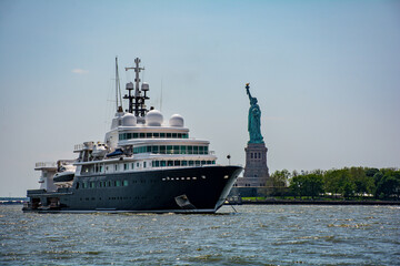 Superyacht and Statue of Liberty New York Harbor