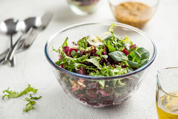 Beet salad with oil and greens.