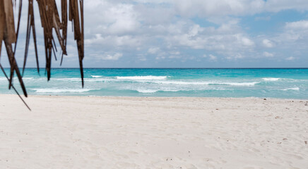 Atlantic sandy beach of Cuba, resort Varadero. Waves and cloudy sky. Scenic seascape