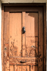 Old wooden door and vintage knocker