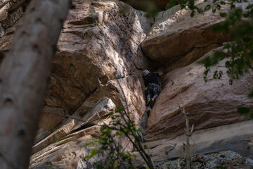 Rock Climber climbing the route Para mis amigos in Suesca Colombia