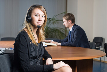 Beautiful business woman with headset