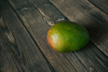 Mango on a wooden background