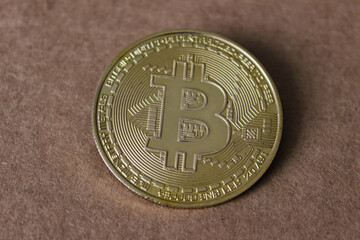 Bitcoin coin - golden Bitcoin coins on black mirror surface