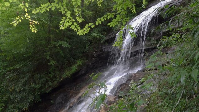 Gentle waterfall in the North Carolina Appalachian Mountains on a green summer day.