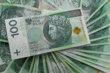 Polish Zloty PLN 100 PLN banknotes background. Cash, money, tax,  economy, busines, bank, tax, bill, debt, success