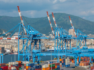Genoa, Italy - 06 06 2021: Panoramic view of the container port and ferry terminal in Genoa, Italy.