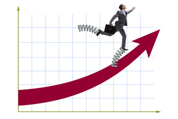 Businessman jumping high on springs