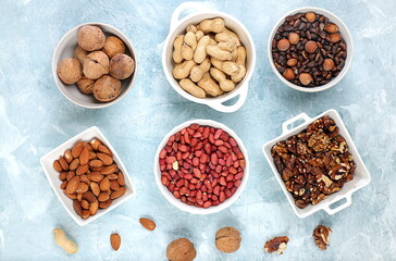 Assortment of various nuts, the concept of healthy natural nutrition, almonds, pecans, pistachios, cashews, walnuts and pine nuts, high-calorie food with vegetable protein and vitamins,