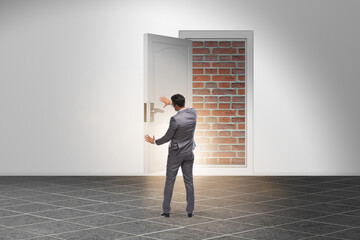 Fototapeta premium Businessman facing no exit with brick door