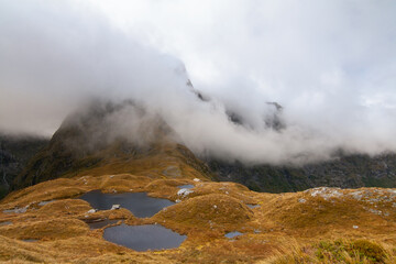 Mount Balloon covered by fog, Milford track, New Zealand